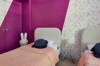 a modern kids room with a purple painted stripe