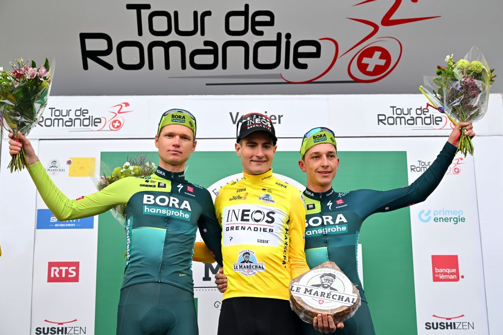 VERNIER SWITZERLAND APRIL 28 LR Aleksandr Vlasov of Russia and Team BORA hansgrohe on second place race winner Carlos Rodriguez Cano of Spain and Team INEOS Grenadiers Yellow leader jersey and Florian Lipowitz of Germany and Team BORA hansgrohe on third place pose on the podium ceremony after the 77th Tour De Romandie 2024 Stage 5 a 1508km stage from Vernier to Vernier UCIWT on April 28 2024 in Vernier Switzerland Photo by Luc ClaessenGetty Images