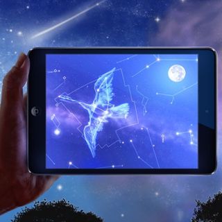 Star Chart app shown on an iPad displaying the Cygnus constellation and moon.