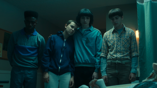 Lucas, El, Mike, and Will at Max's hospital bedside in Stranger Things Season 4x09