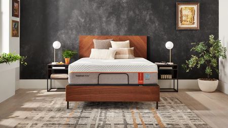 The Tempur-Pedic Tempur-Contour Luxe Breeze 1.0 mattress on a bed frame in a styled room