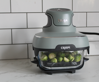 Cooking sprouts in the Ninja Crispi Portable Glass Air Fryer in the test kitchen