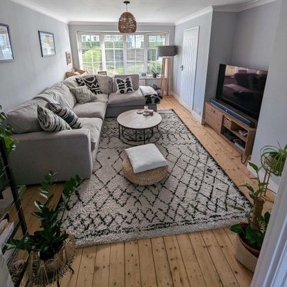 living room with rug and wooden floor