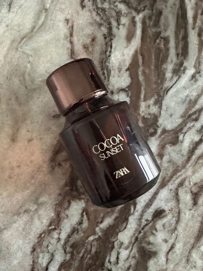 Zara Cocoa Sunset perfume on a marble background