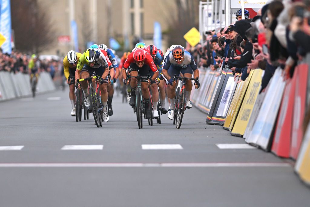 KOKSIJDE BELGIUM MARCH 15 LR Gerben Thijssen of Belgium and Team Intermarche Wanty race winner Luca Mozzato of Italy and Team Arkea BB Hotels and Dylan Groenewegen of The Netherlands and Team Jayco AlUla sprint at finish line during the 22nd Bredene Koksijde Classic 2024 a 2012km one day race from Bredene to Koksijde on March 15 2024 in Koksijde Belgium Photo by Luc ClaessenGetty Images