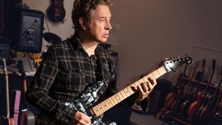 Andy Summers poses in his home studio in 2019 for a feature in Guitar Player magazine