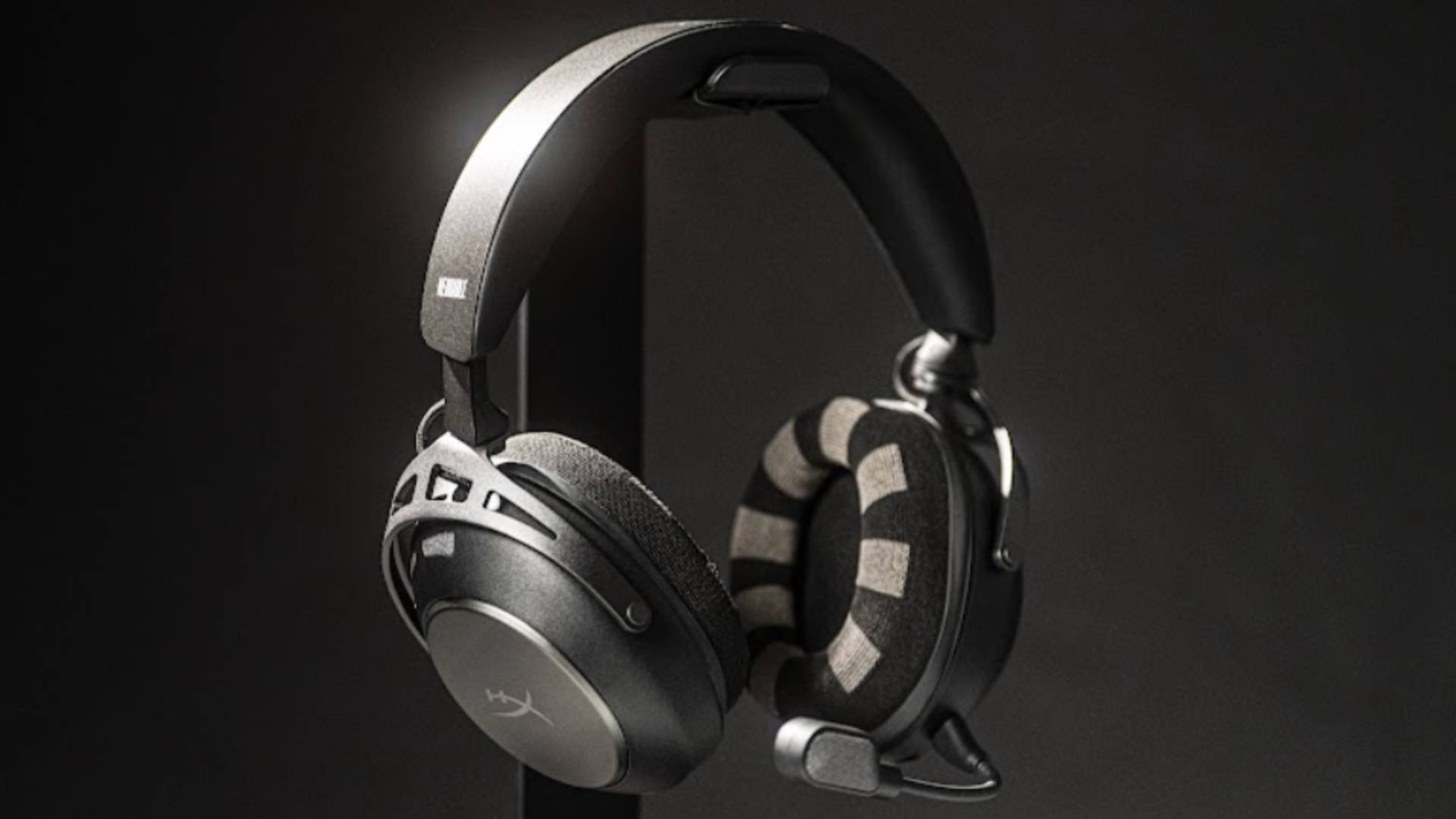 Photo of the black and white colored Neurable and HyperX gaming headset, with a black background behind it.