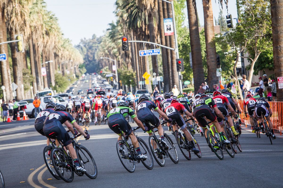 The men get strung out along the back side of the course