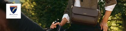 Woman riding horse with a cross body brown aspinal of london bag