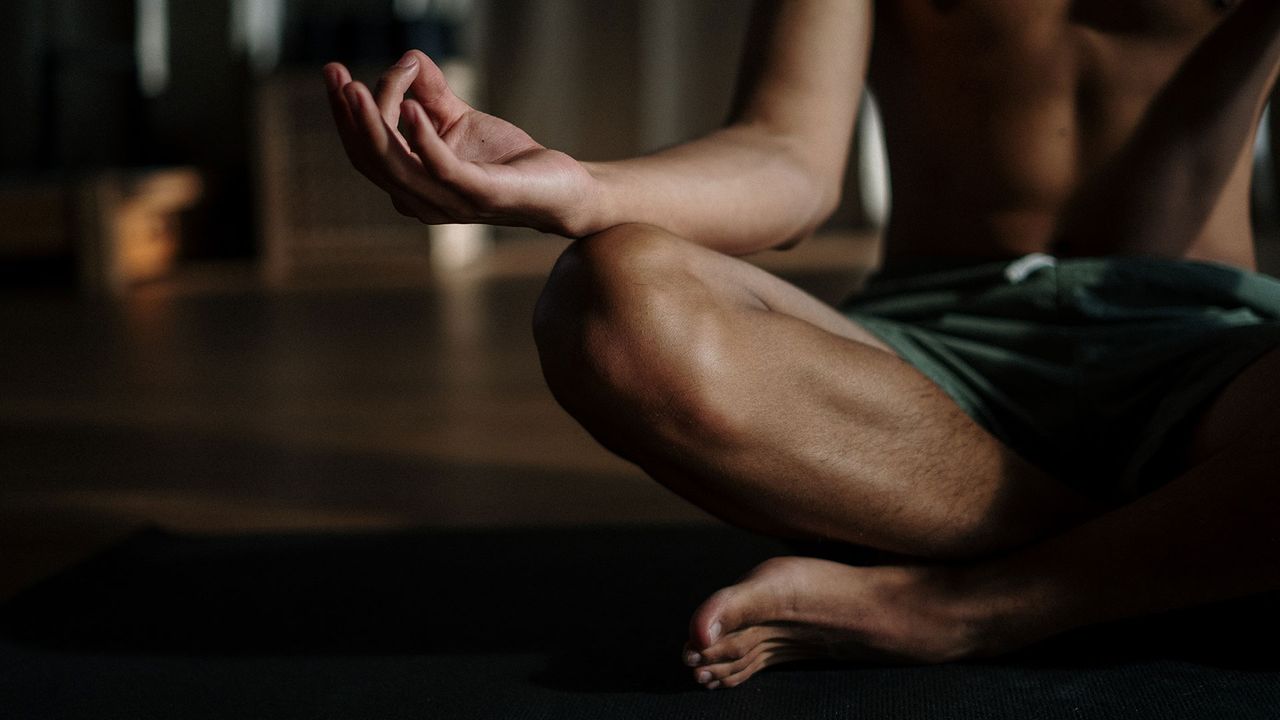 Man sitting cross legged on the floor