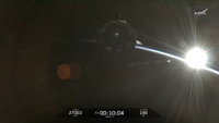 SpaceX Crew-12 Dragon flies free over the Earth during a sunrise