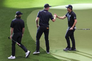 Tommy Fleetwood, Justin Rose and Collin Morikawa of LAGC during a TGL match