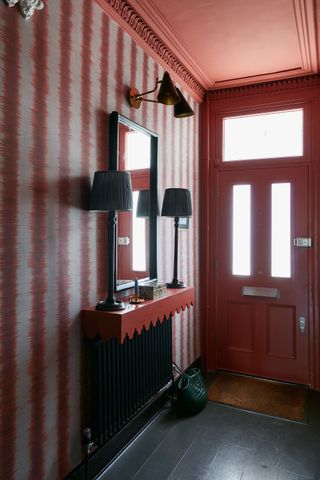 a red painted ceiling in a hallway
