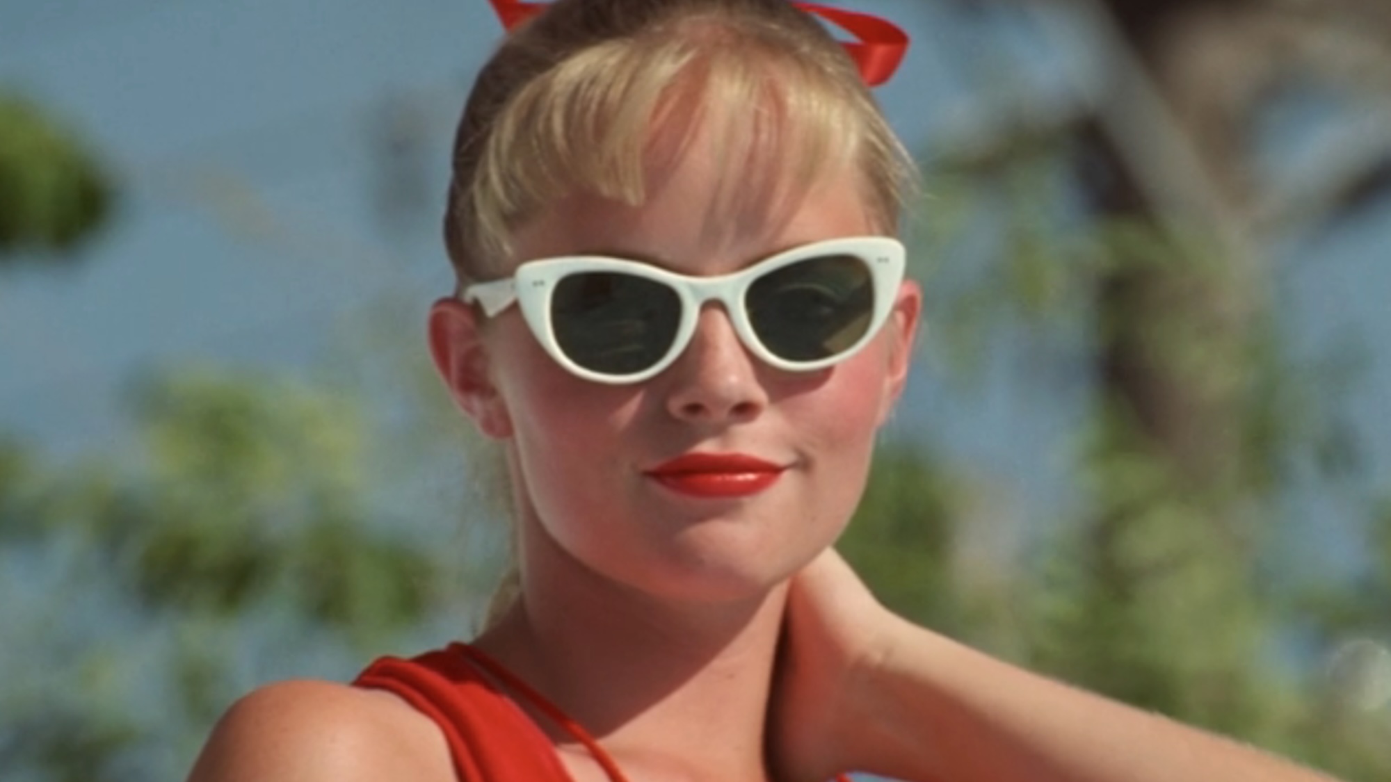 Wendy Peffercorn smiling in sunglasses in The Sandlot