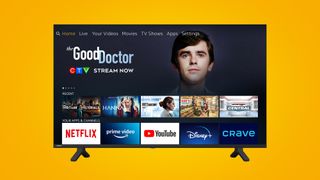 4K smart TV on a yellow TechRadar deals background