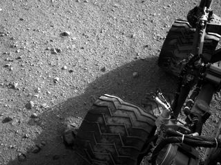Martian dirt clings to the wheels of NASA's Curiosity rover in this photo taken Aug. 28, 2012, after the rover's first long drive, a 52-foot trek.