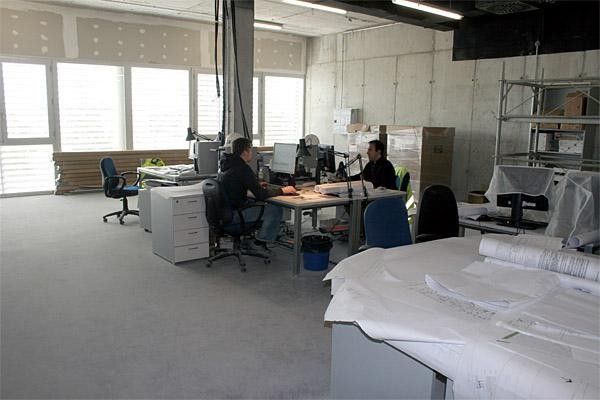 The architects hard at work in the unfinished office