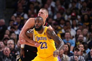 Nikola Jokic #15 of the Denver Nuggets and LeBron James #23 of the Los Angeles Lakers looks on during the game during Round 1 Game 2 of the 2024 NBA Playoffs