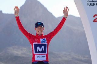 US Matteo Jorgenson of Movistar Team poses on the podium in the red jersey after winning the third stage of the Tour of Oman 2023 from alKhobar to Jabal Haat on February 13 2023 Photo by Thomas SAMSON AFP Photo by THOMAS SAMSONAFP via Getty Images