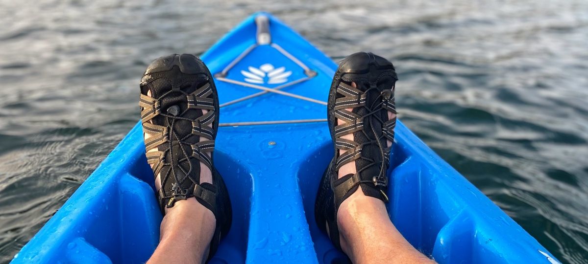 Man wearing Keen Drift Creek H2 sandals in kayak