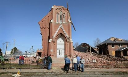 Ridgeway, Ill., residents look over the remains of the 110-year-old St. Joseph's Catholic Church after tornados ripped through the South and Midwest last week.