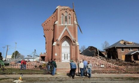 Ridgeway, Ill., residents look over the remains of the 110-year-old St. Joseph&amp;#039;s Catholic Church after tornados ripped through the South and Midwest last week.