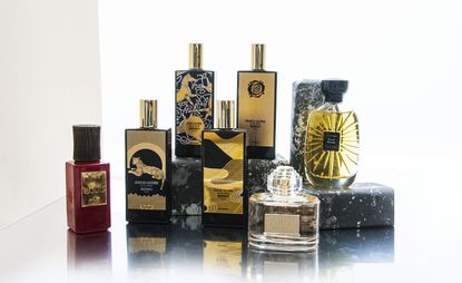 Various sized bottles of perfume