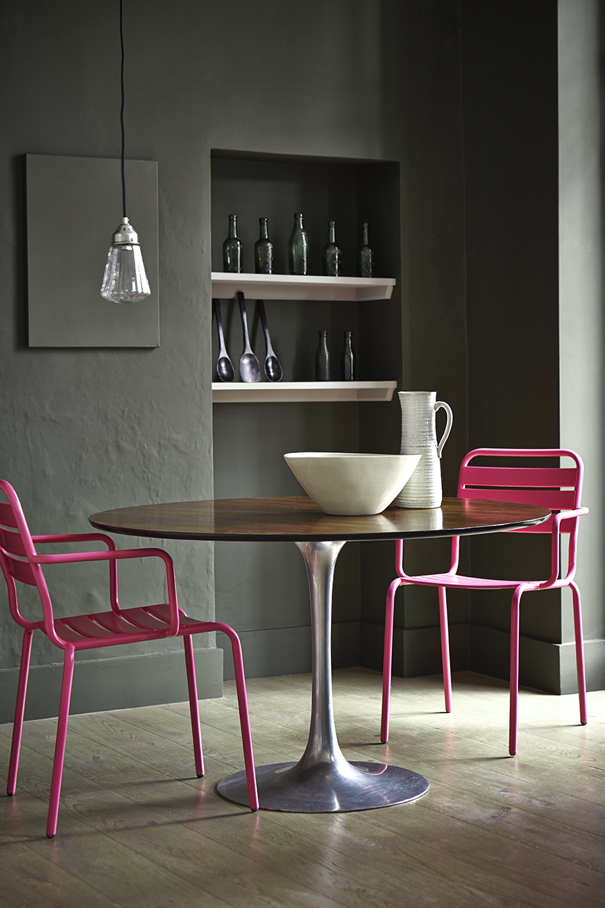 Charcoal grey room with hot pink furniture by Little Greene