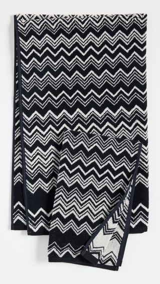 a black and white striped beach towel