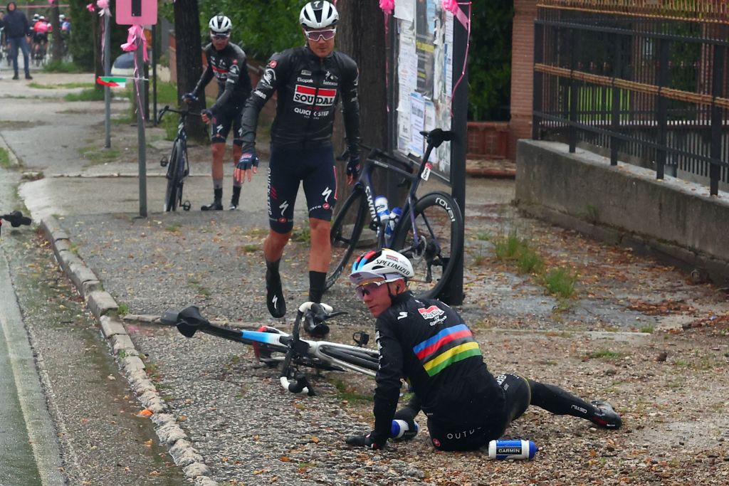Soudal Quick Steps Belgian rider Remco Evenepoel foreground is seen after crashing during the fifth stage of the Giro dItalia 2023 cycling race 171 km between Atripalda and Salerno on May 10 2023 Photo by Luca Bettini AFP Photo by LUCA BETTINIAFP via Getty Images
