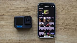 GoPro Quik on an iPhone next to a GoPro Hero 10 Black