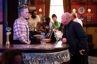 Phil Mitchell has news for Linda Carter