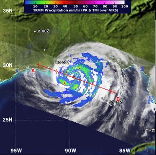 NASA's TRMM satellite captured a view of Isaac's rainfall rates on the night of Aug. 28, just 3 hours and 20 minutes after its first landfall in southeastern Louisiana. The purple areas indicate the heaviest rainfall, near 2.7 inches (70 mm) per hour.