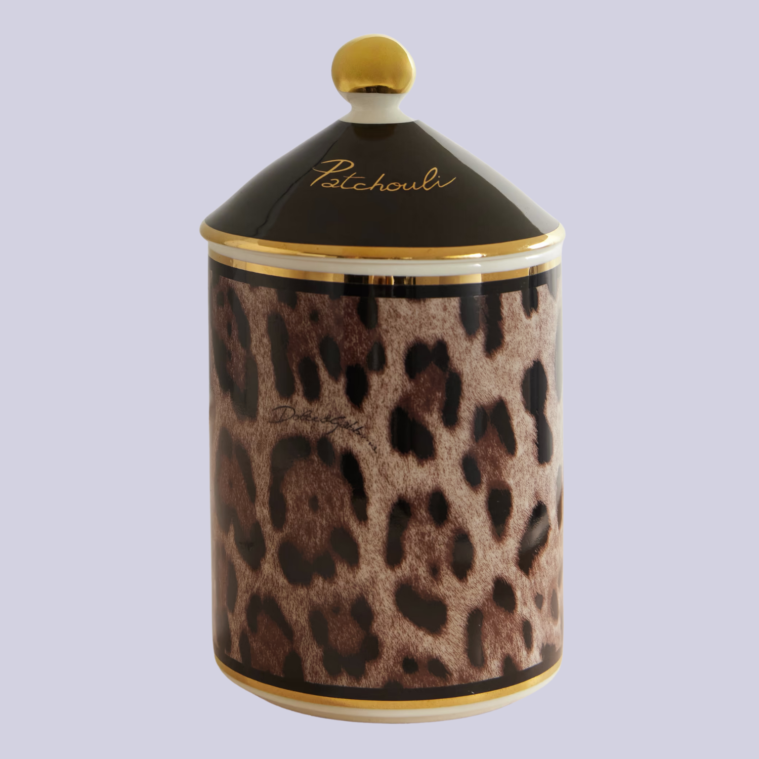 A leopard print candle with a lid