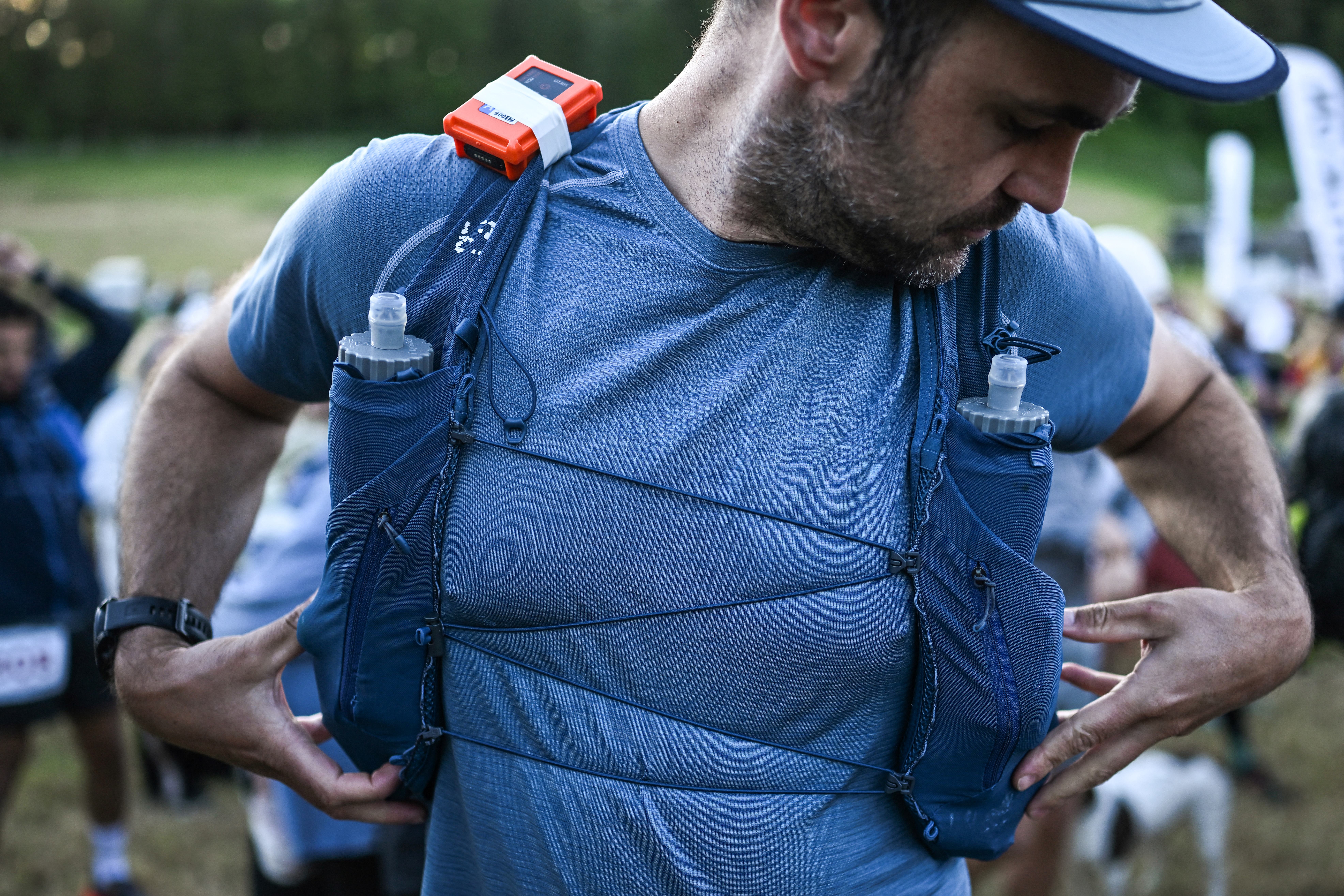 Runner Guy Shepherd checks his equipment as he prepares to take the start of the Centurion South Downs Way 100 ultramarathon in Winchester, south west of London on June 8, 2024. The Centurion South Downs Way 100, is an ultramarathon, predominantly off road course, covering a distance of 100 miles (160,9 kilometres) and that takes the competitors along the South Downs Way from Winchester in Hampshire to Eastbourne in East Sussex.