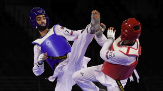 Mohamed Khalil Jendoubi of Team Tunisia competes against Vito Dell'Aquila (R) of Team Italy ahead of the Taekwondo live stream at Olympics 2024