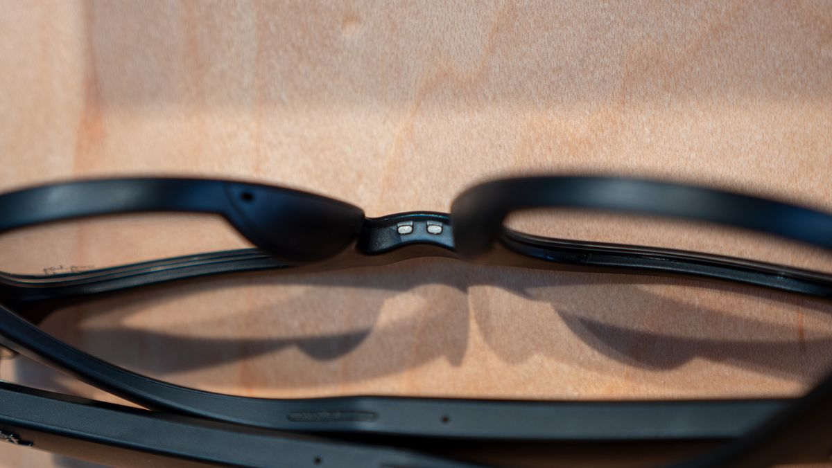 A close-up look at Ray-Ban Meta smart glasses charging pins in the nosepiece