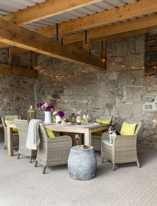 outdoor dining ares with roof and wicker chairs