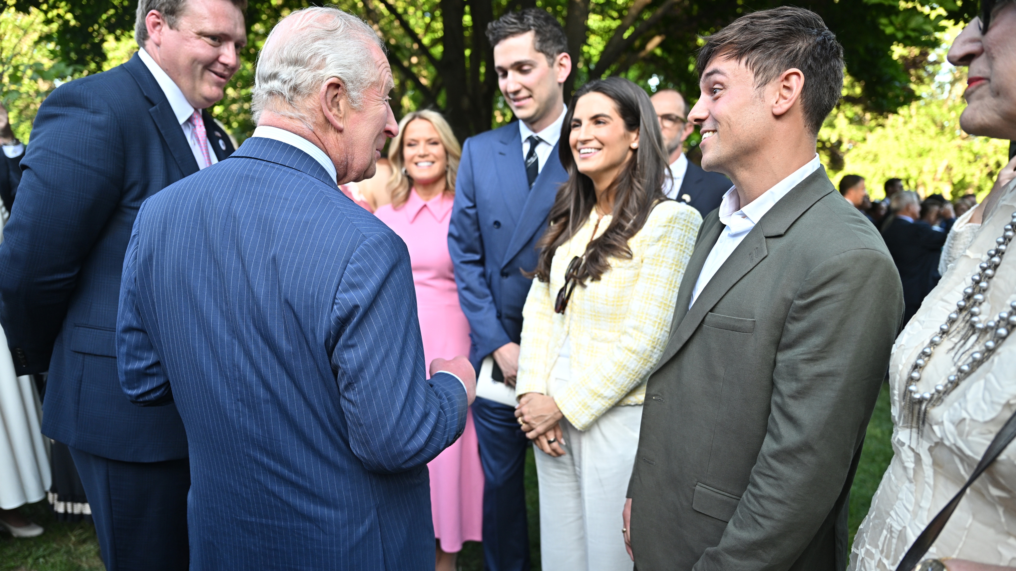 King Charles III chats with Tom Daley (R) and other guests during a Garden Party on day one of their State Visit to the United States of America, on April 27, 2026