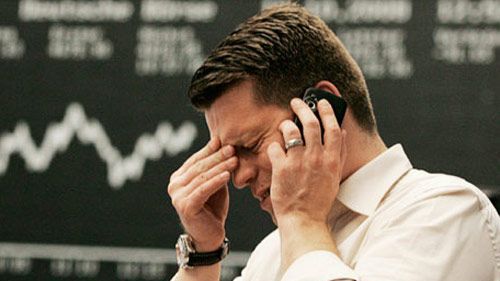 stressed looking stock market guy on phone