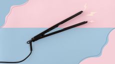 A pair of hair straighteners on a pink and blue backdrop with lightning bolts illustrated to demonstrate hair straightener uses