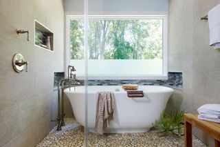 Wet room with large window over tub