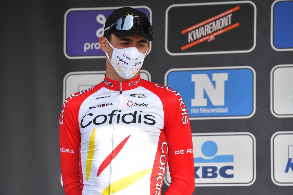 WAREGEM BELGIUM MARCH 31 Podium Christophe Laporte of France and Team Cofidis Celebration during the 75th Dwars Door Vlaanderen 2021 Mens Elite a 1841km race from Roeselare to Waregem Mask Covid safety measures DDV DDV21 FlandersClassic A travers la Flandre on March 31 2021 in Waregem Belgium Photo by Luc ClaessenGetty Images