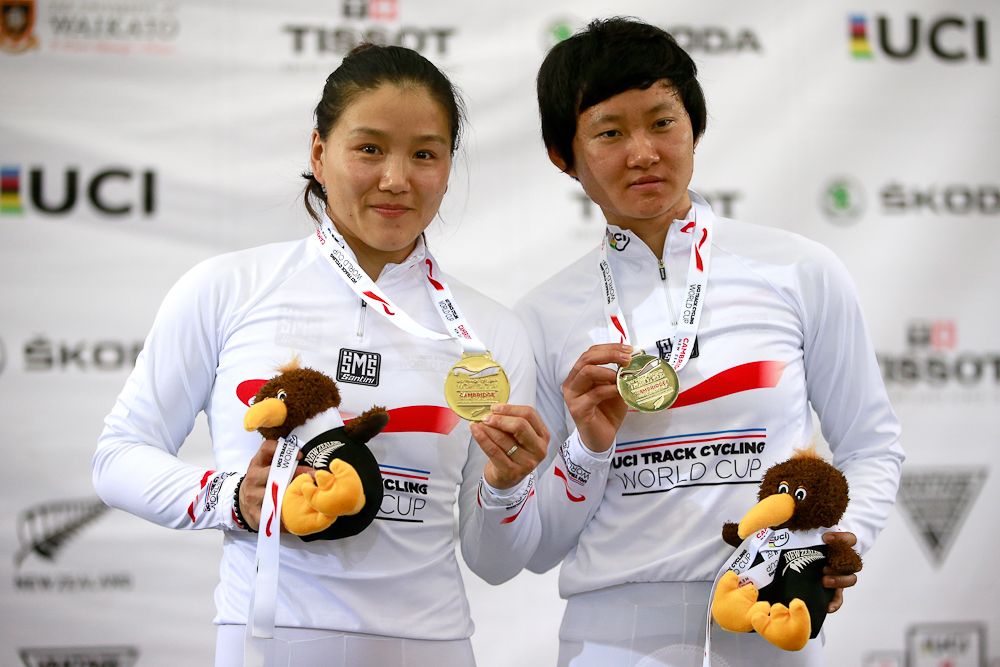 Jinjie Gong and Tianshi Zhong of China celebrate their gold medal in the Womens Team Sprint
