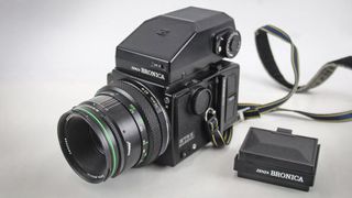 A selection of vintage cameras against a white background