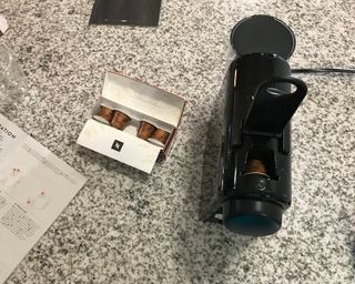 Inserting Original Line capsules into the Nespresso Essenza Mini coffee maker