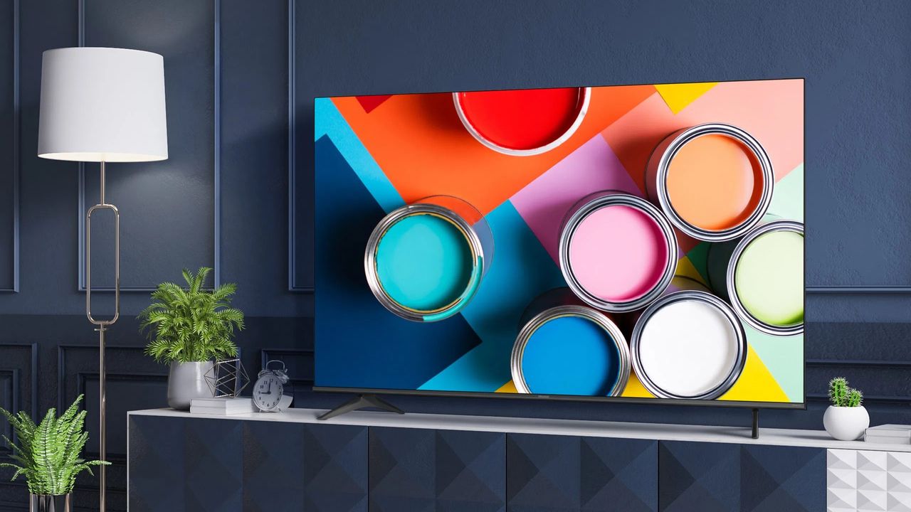 Hisense A6G TV in living room with colored paint pots on screen