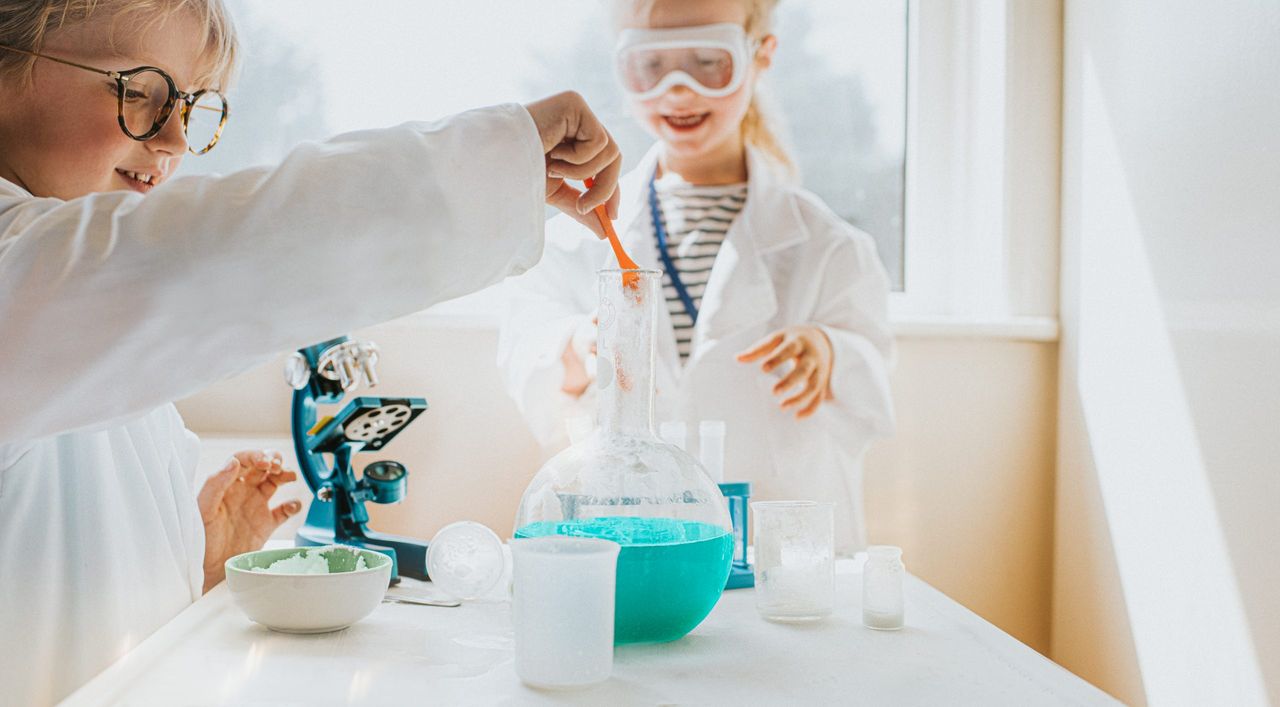 Children playing with science experiments for kids