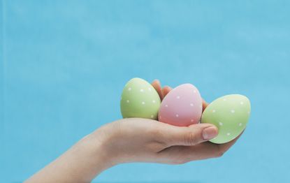 woman holding easter eggs