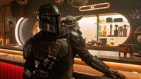 Din Djarin (Pedro Pascal) and Grogu look ahead in The Mandalorian and Grogu.